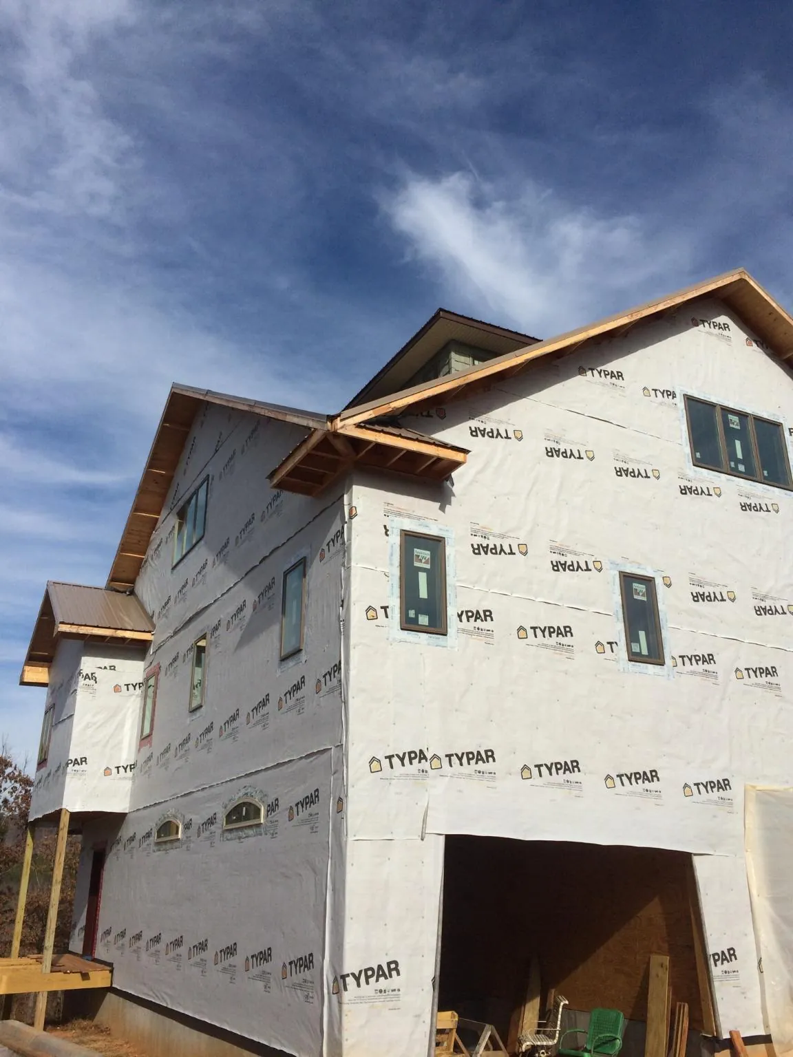 Stick built house wrapped in Typar with new roof framing and dormers in Barto